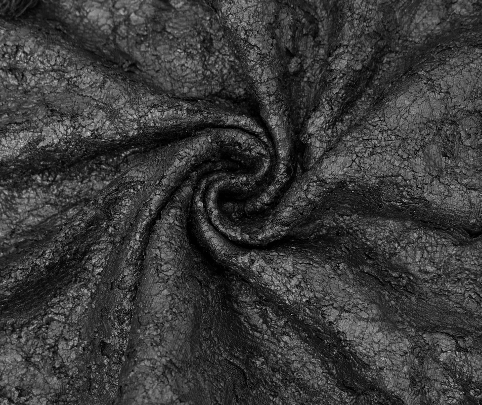 Close-up of textured black fabric showcasing a gothic aesthetic, perfect for a stylish black hooded sleeveless top.