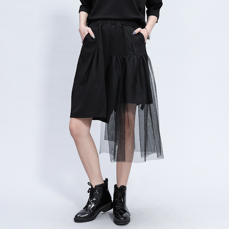 Black irregular half-length trousers with high elastic waist and mesh layer, perfect for alternative fashion.