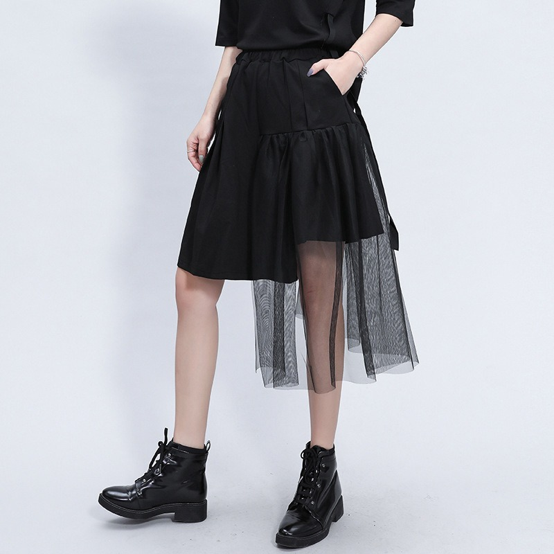 Stylish black irregular half length trousers featuring a high elastic waist and mesh overlay, perfect for alternative fashion.