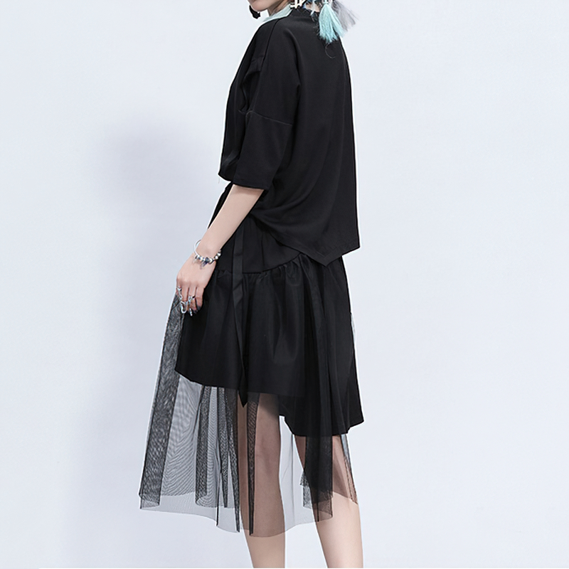 Black irregular half length trousers with a mesh layer, perfect for alternative fashion and rockstar outfits.