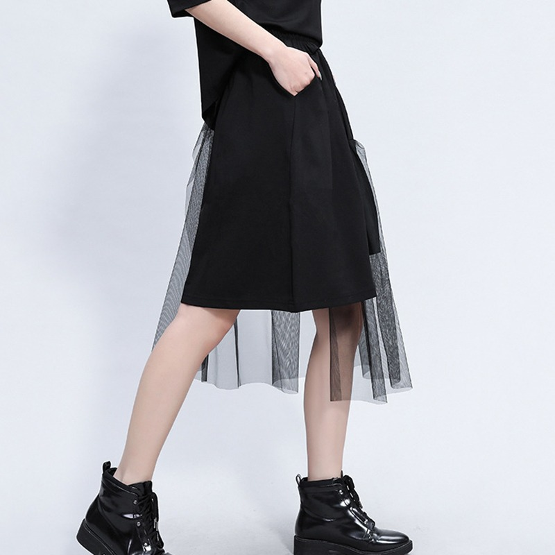 Black asymmetrical trousers with mesh layer, perfect for alternative fashion and rockstar outfits, featuring a high elastic waist.