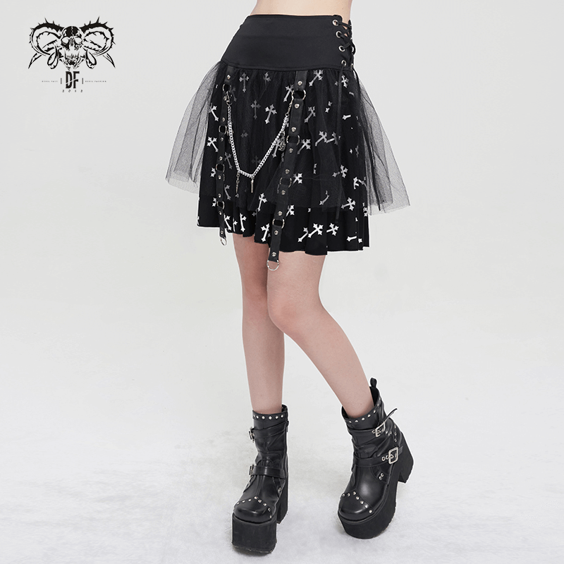 Black knitted punk skirt with white crosses print, side straps, chains, and tulle overlay, perfect for edgy fashion lovers.