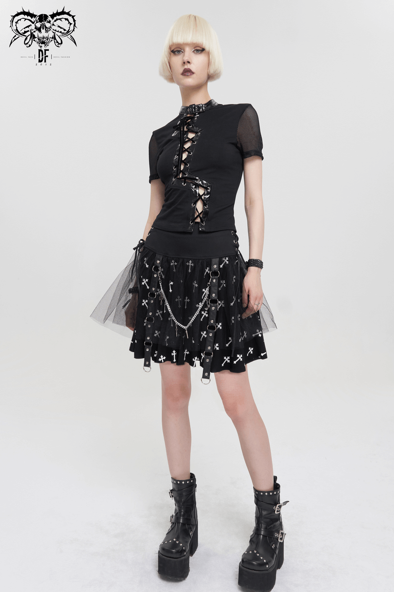 Punk women's fashion featuring a black knitted skirt with white crosses and stylish accessories.