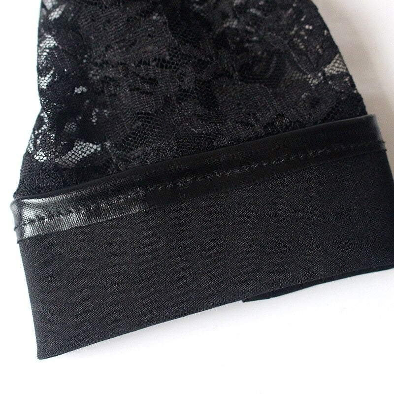Close-up of black lace long women's gloves with faux leather trim, perfect for gothic fashion and elegant party outfits.