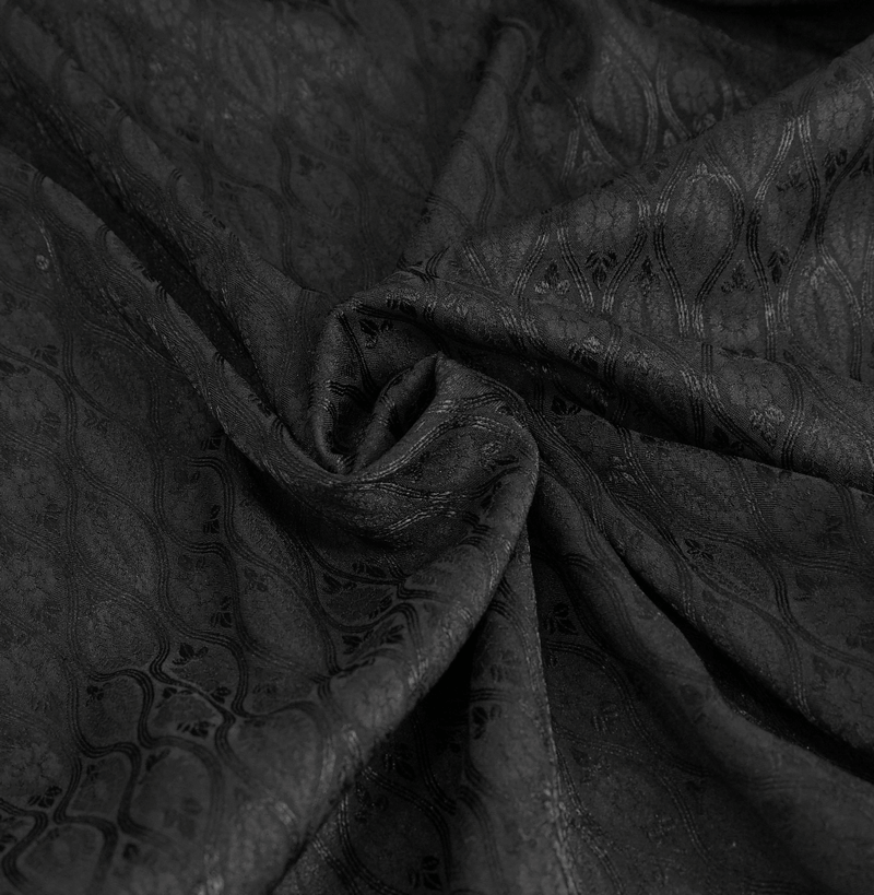 Luxurious black fabric with intricate patterns, perfect for a gothic flared sleeves long coat.