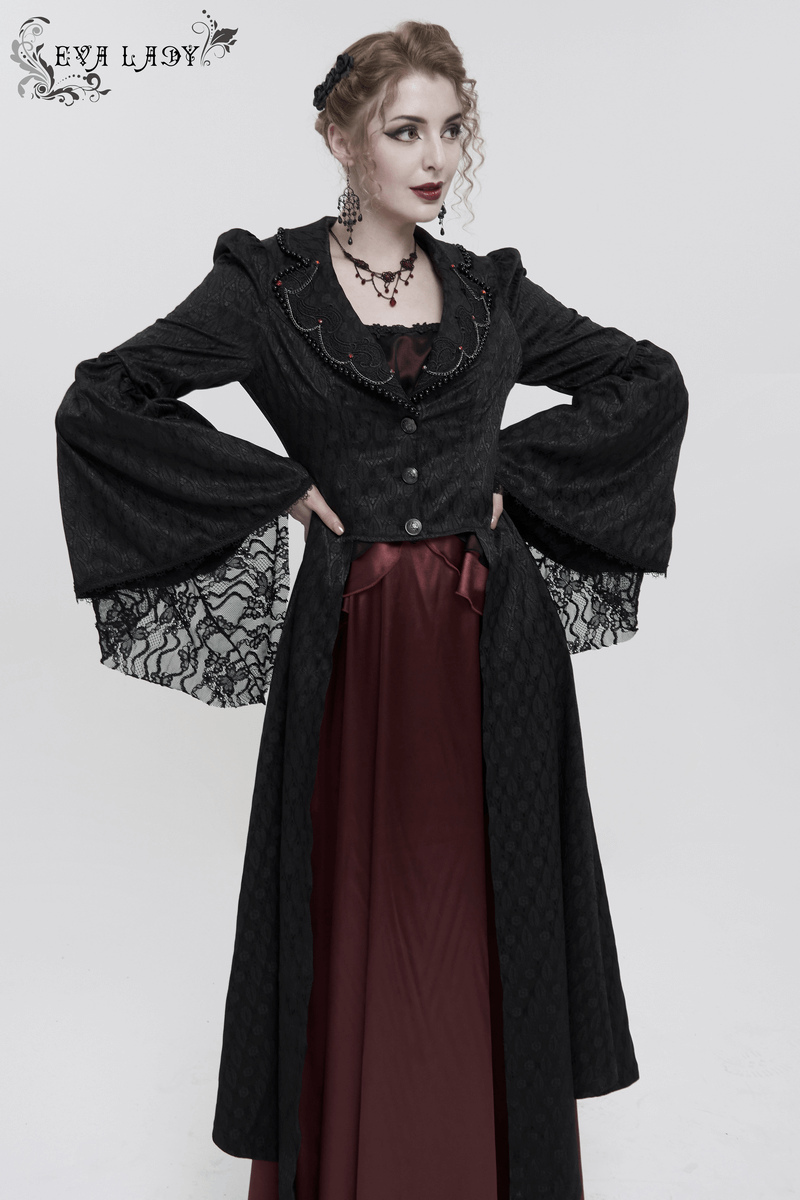 Elegant woman in a black flared sleeves beaded gothic long coat, wearing a red dress and accessories, showcasing retro style.