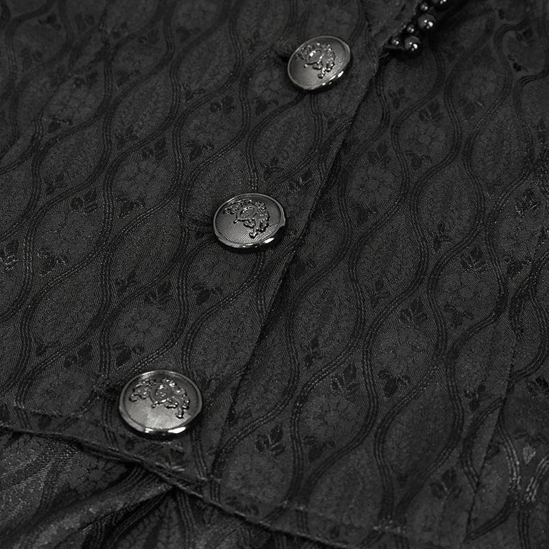 Close-up of black fabric with elegant pattern and gothic buttons for ladies flared sleeves long coat.
