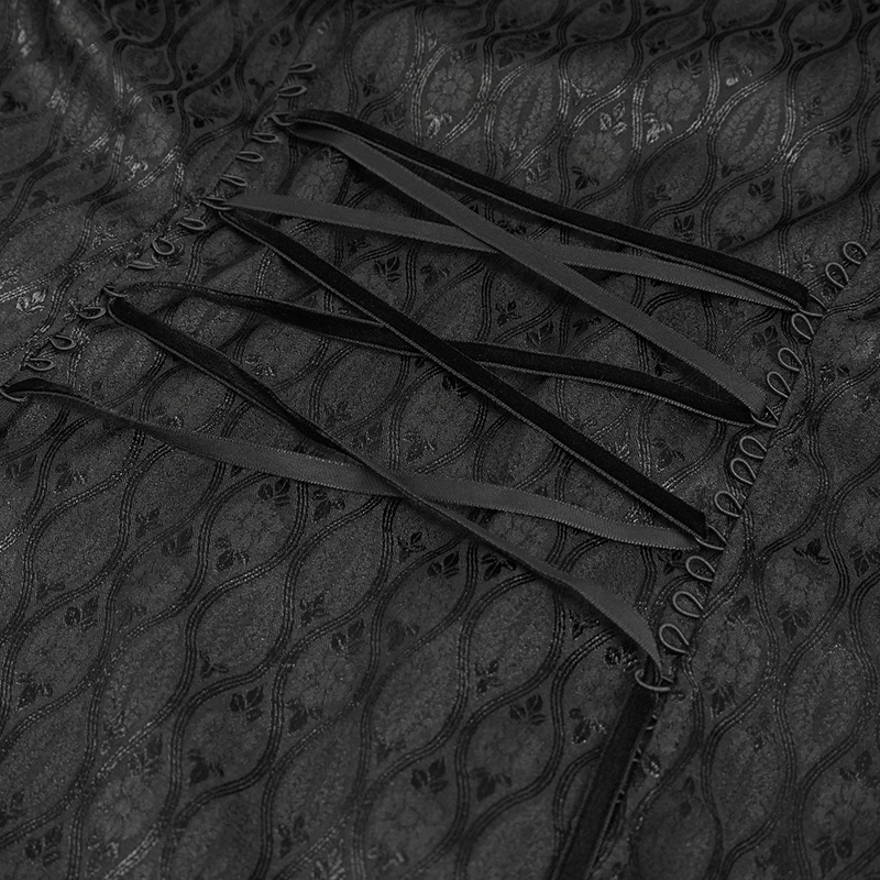 Close-up of black fabric with elegant patterns and lace-up detail, showcasing gothic style for women's long coat.