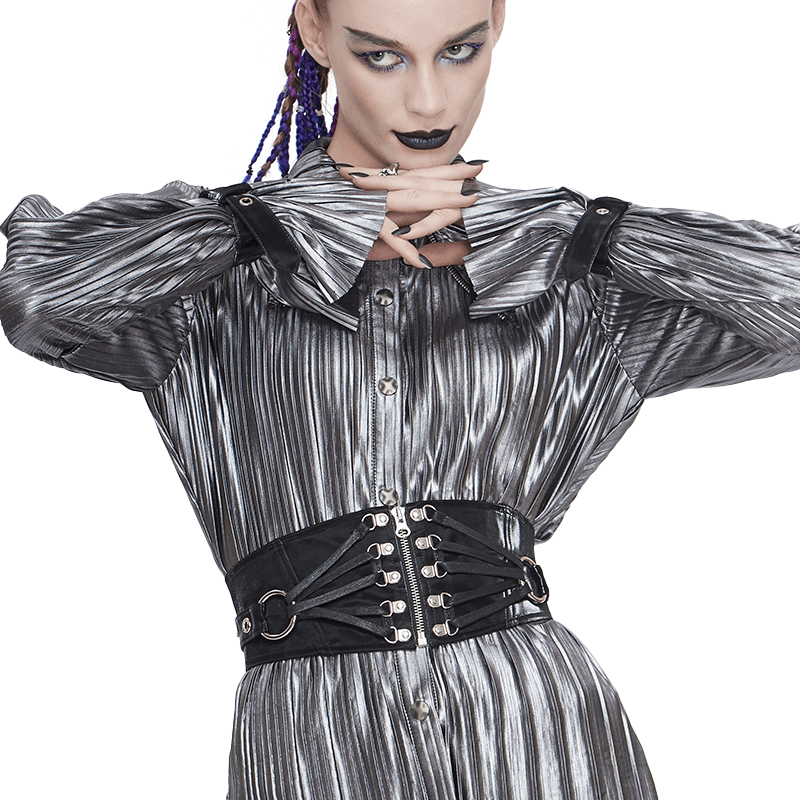 Gothic style women's black wide belt with rivets and zipper, accentuating a chic look on a model in a shiny silver blouse.