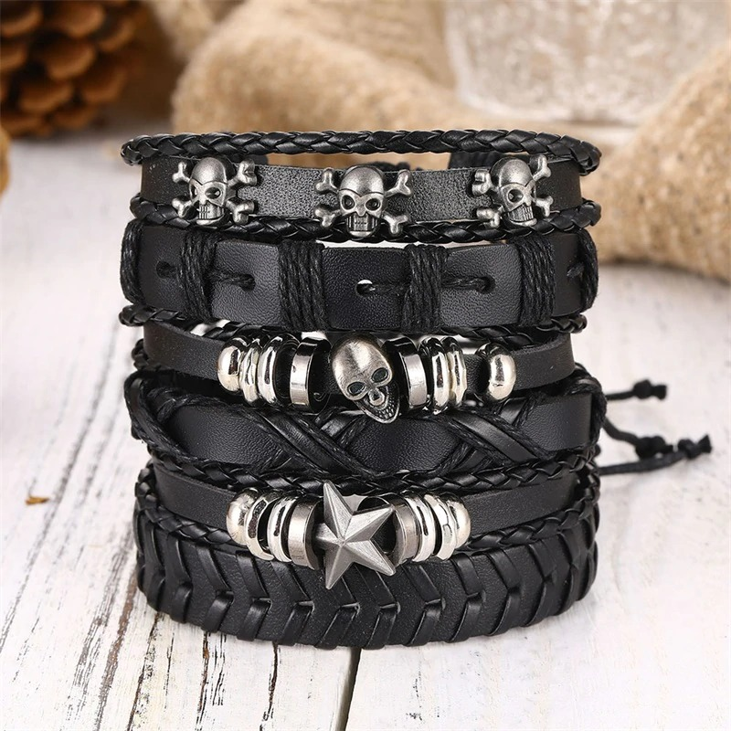 Black leather bracelet set with skull and star designs, unisex wristband collection of 6 pieces, edgy rock style.