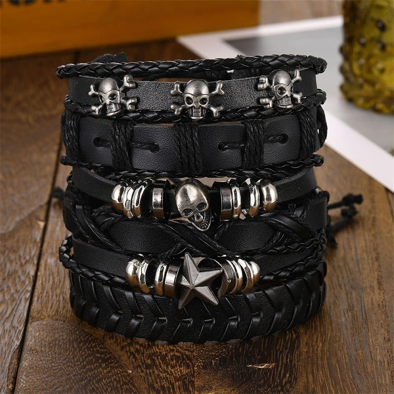 Set of 6 unisex black leather bracelets with skulls and stars, perfect for adding rock style to any outfit.