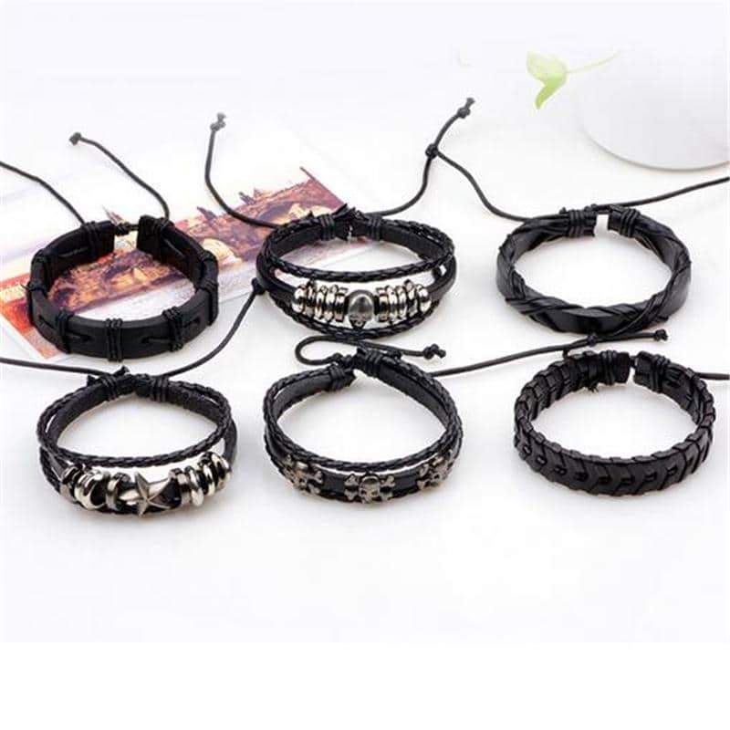 Black leather bracelet set of 6 with skulls and stars, perfect unisex rock style accessories.