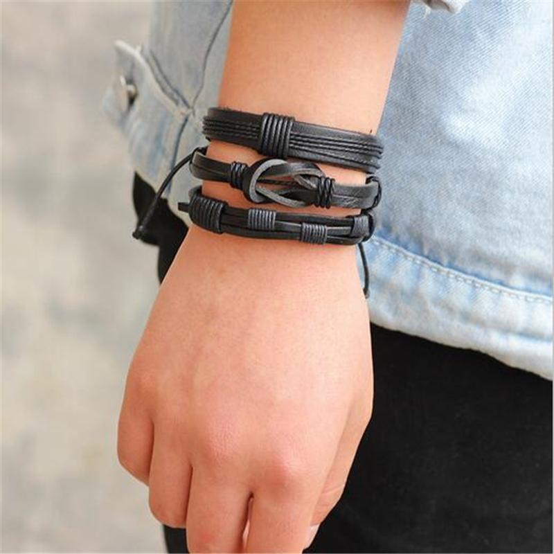 Black leather rock style bracelets on male wrist, showcasing a set of 5 trendy geometric designs.