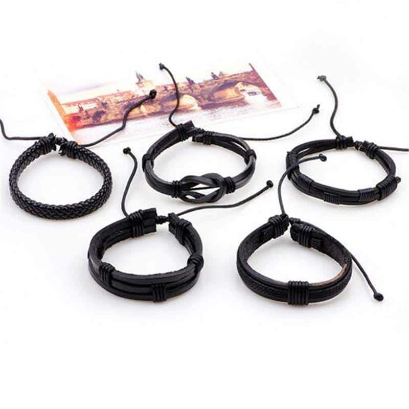 Set of 5 black leather bracelets in rock style, featuring woven and knotted designs, perfect for a trendy men's look.