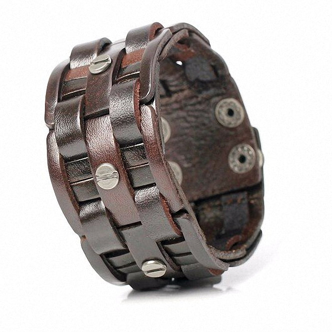 Handmade black leather woven bracelet with metal buttons, stylish and unisex, perfect for rock-style outfits.