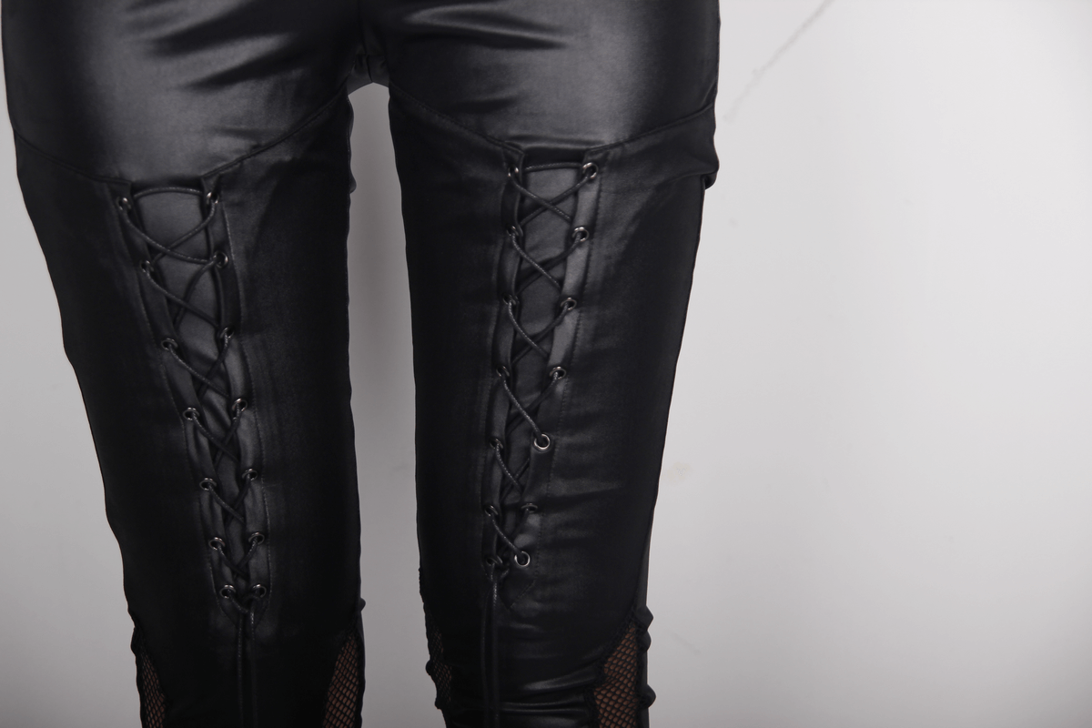 Close-up of black PU leather leggings featuring stylish lacing and mesh inserts, perfect for punk outfits.