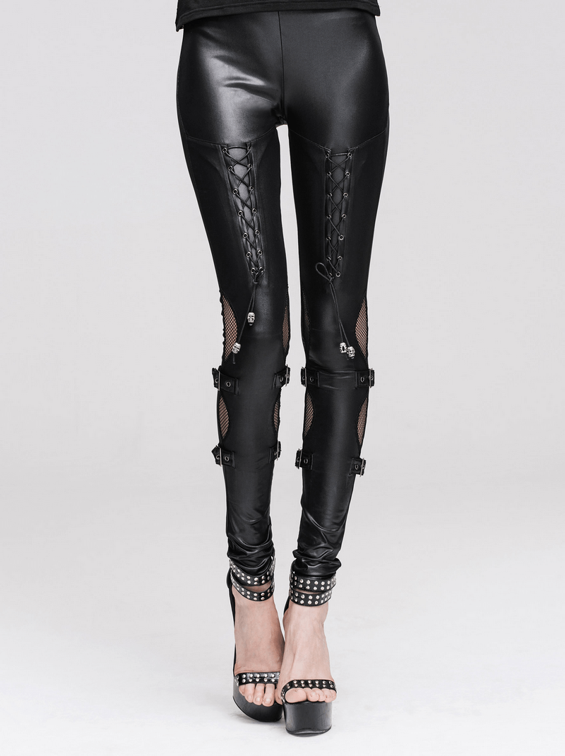 Stylish women's black PU leather leggings with lacing, mesh inserts, and buckles for a punk steampunk look.