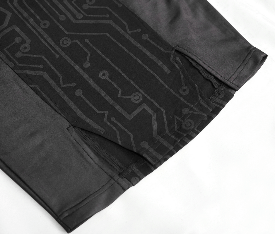 Close-up of black fabric with circuit pattern, showcasing sleek design and modern style for tech-inspired apparel.