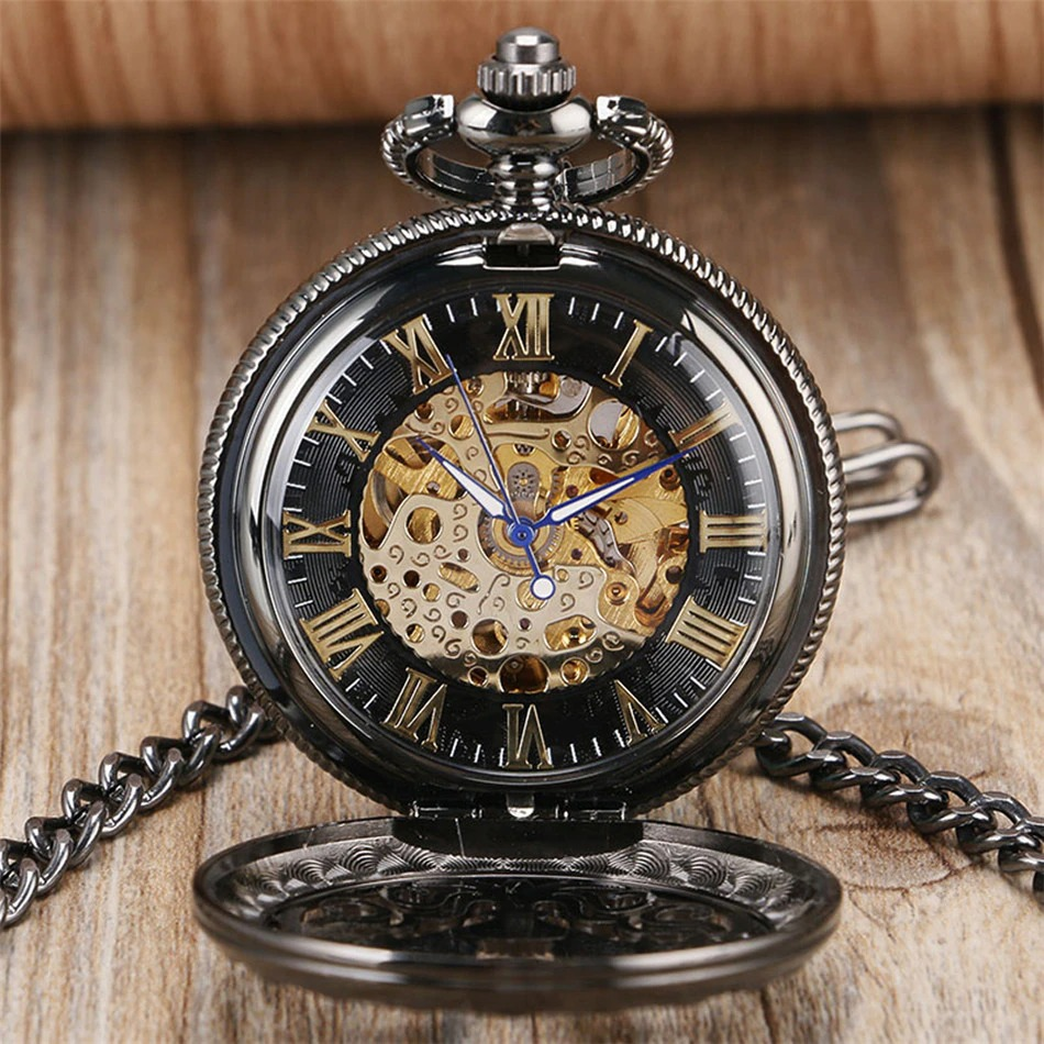 Elegant black mechanical pocket watch with Roman numerals and intricate golden gears, perfect accessory for vintage style.