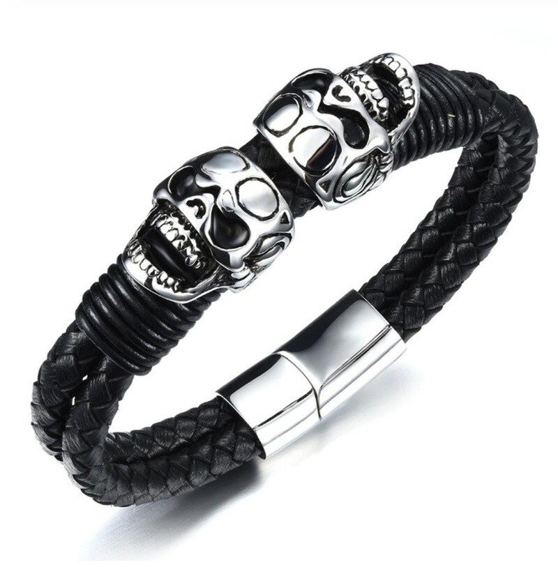 Black men's braided rope leather bracelet featuring stainless steel skulls, perfect for punk rock style enthusiasts.