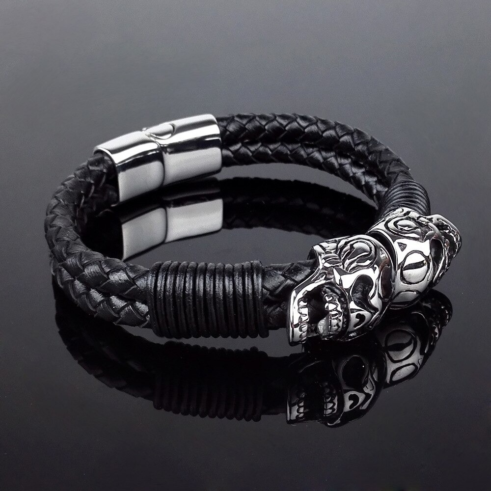 Black braided rope leather bracelet with stainless steel skulls, stylish gothic jewelry for men.