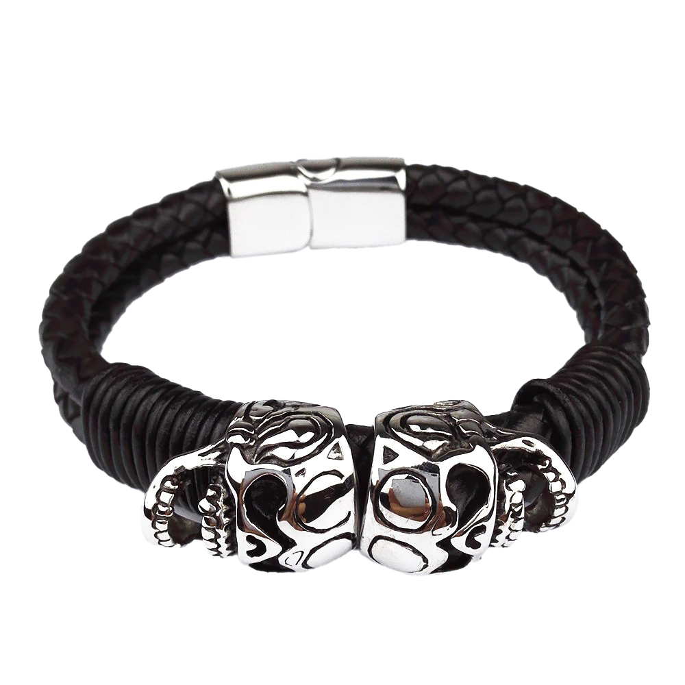 Black leather braided bracelet with stainless steel skulls, perfect for gothic punk rock style accessories.