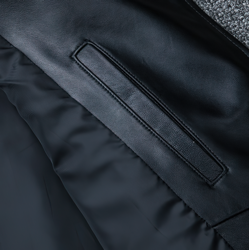 Close-up of the inner pocket of a black men's genuine leather jacket, showcasing quality craftsmanship and modern design.