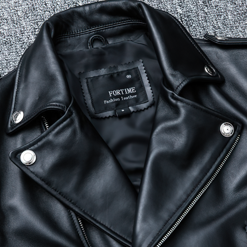 Close-up of a stylish black men's leather jacket inner label from FORTIME, showcasing quality design and craftsmanship.