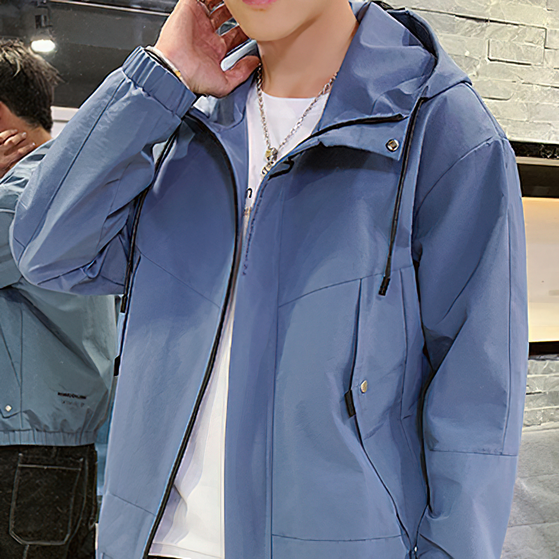 Casual blue hooded jacket with zippers, perfect for stylish layering in any season.