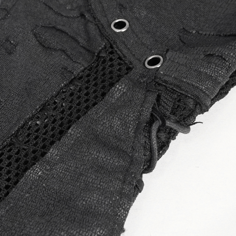 Close-up of black net splicing and zipper detail on gothic women's short dress, showcasing unique texture and style.