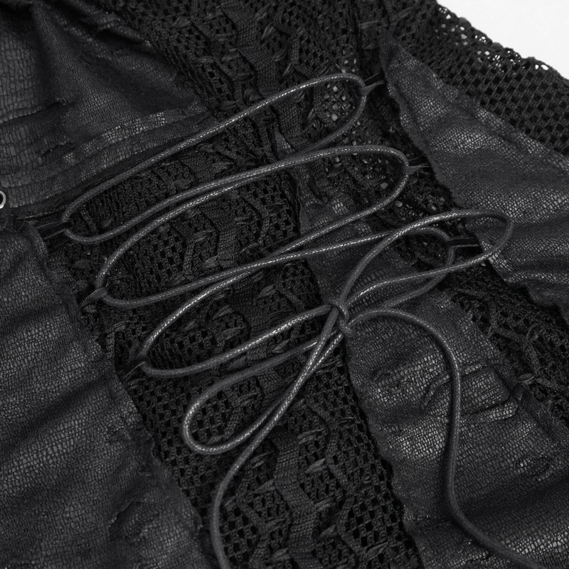 Close-up of black net splicing and zipper pulls on gothic-style women's short dress.