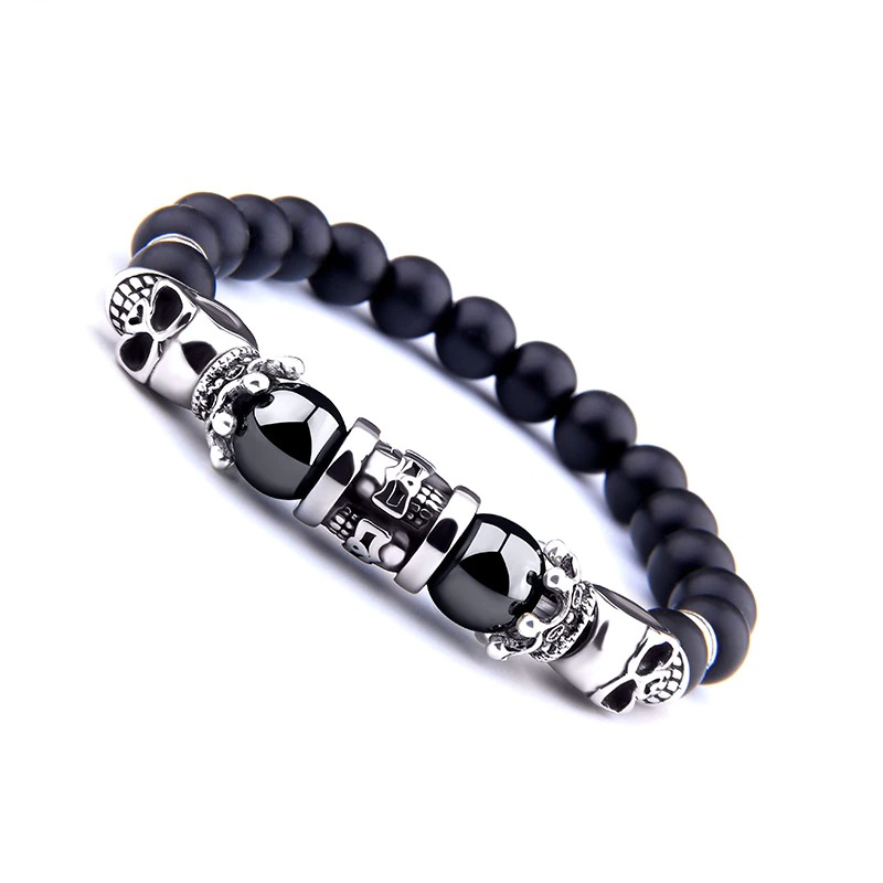 Black onyx stone bracelet featuring silver skull beads, perfect for punk style jewelry for men and women.
