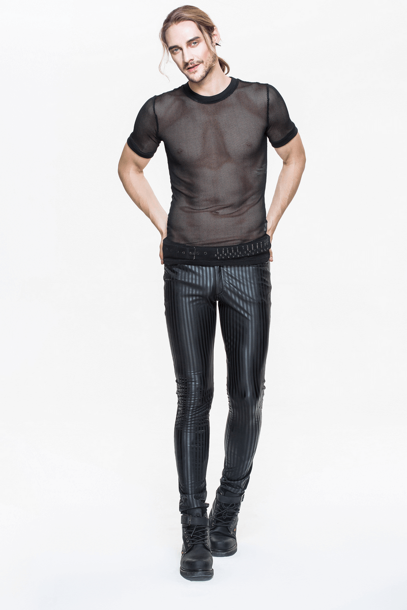 Stylish man wearing black fitted trousers with vertical stripes and a sheer top, perfect for a gothic aesthetic.