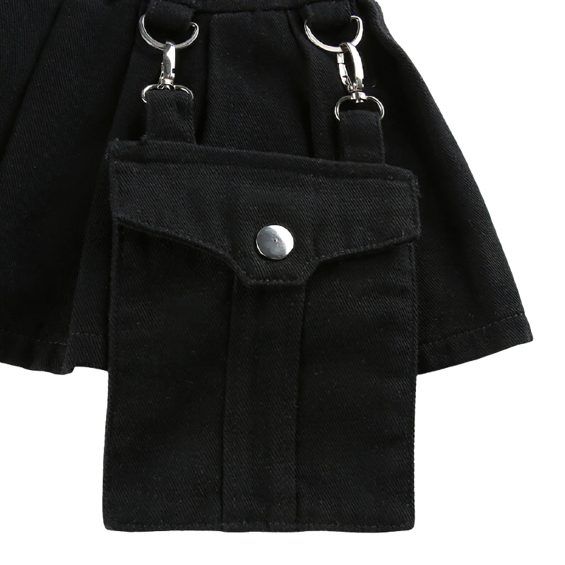 Close-up of black patchwork skirt pants featuring hanging pocket and silver rivets for a trendy gothic streetwear look.