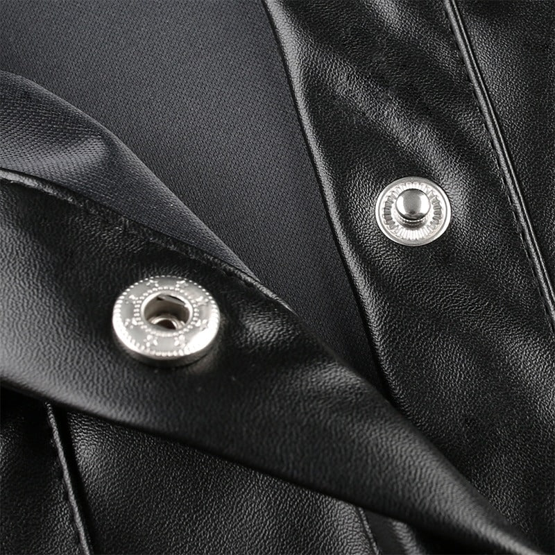 Close-up of black PU leather blouse with stylish snap buttons and sleek fabric details.
