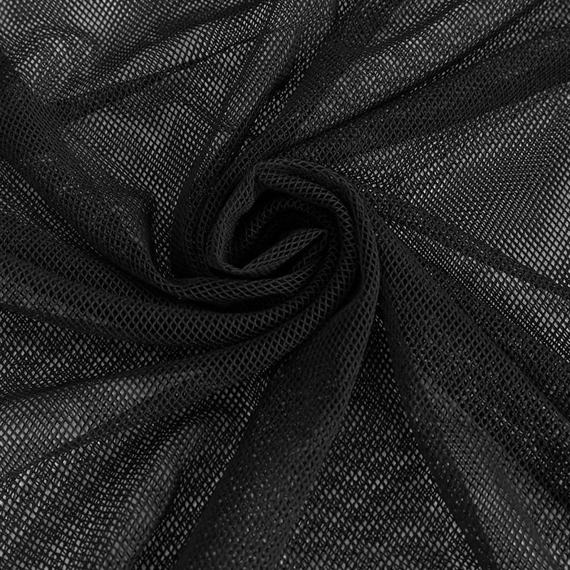 Close-up of black mesh fabric, showing transparent net texture for stylish punk long sleeve tops.