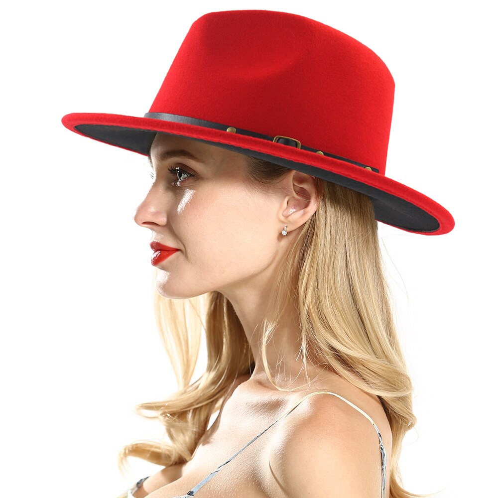 Stylish woman modeling a vibrant red wool fedora with a black band, perfect for any season and outfit.