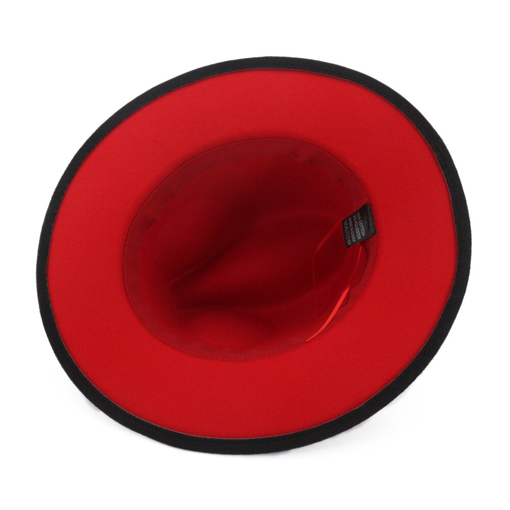 Inside view of a stylish black and red wool felt fedora featuring a vibrant red interior and black trim.