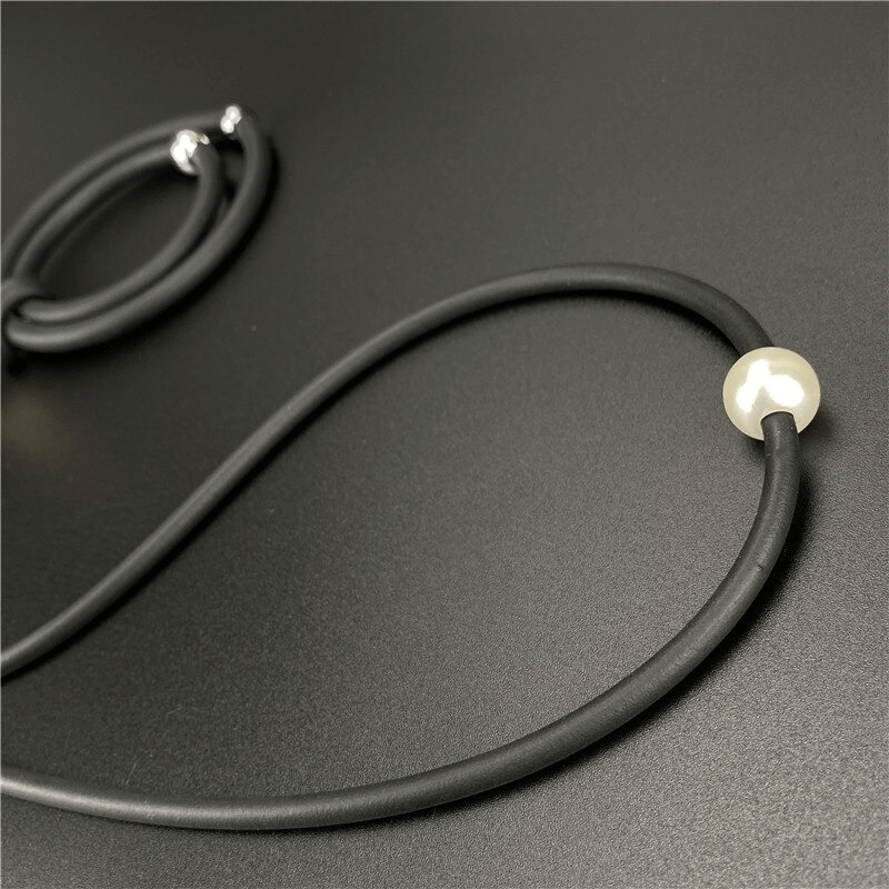 Black round pendant necklace with alloy beads, perfect for casual women's fashion accessories.