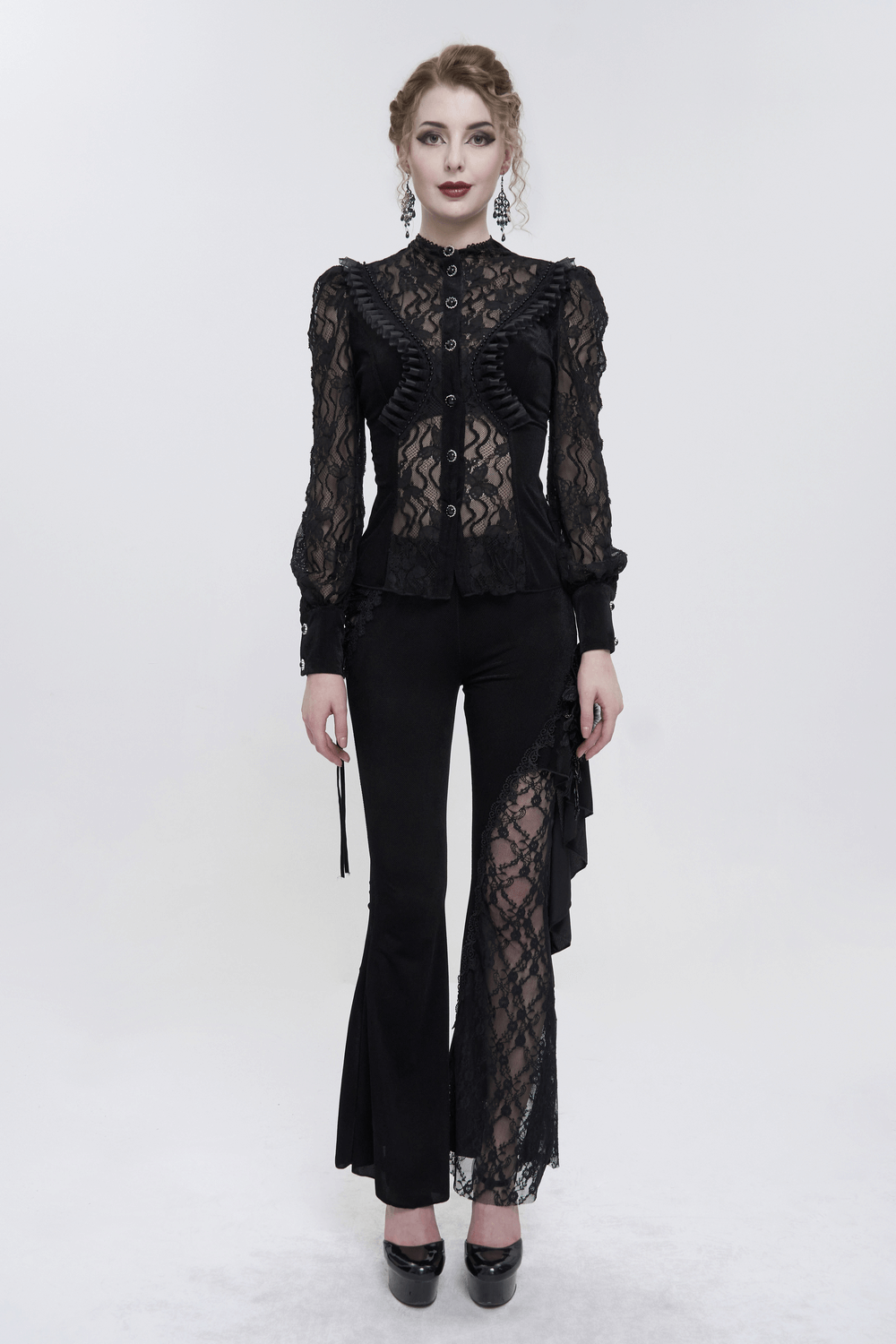 Gothic black velvet blouse with lace ruffle sleeves and sleek pants for a chic women's fashion statement.