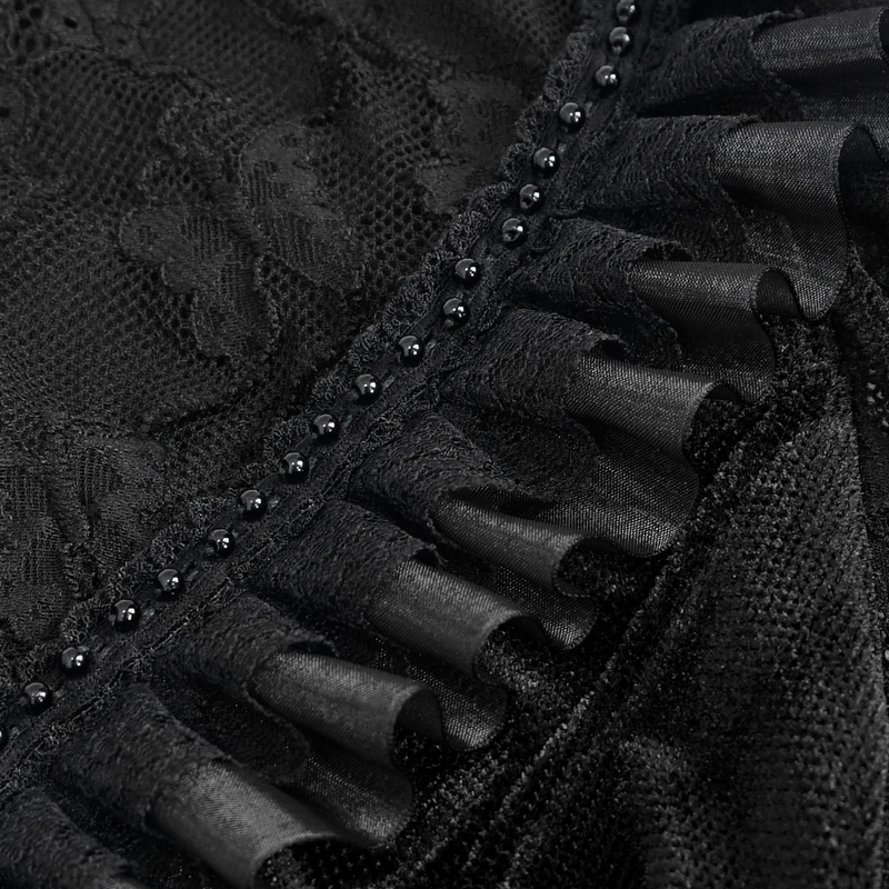 Close-up of black lace ruffle with velvet texture and decorative beads, perfect for a gothic blouse.
