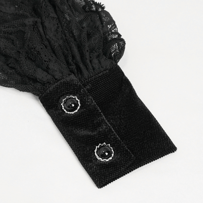 Close-up of black lace ruffled sleeve with velvet cuff and decorative buttons for gothic women's blouse.