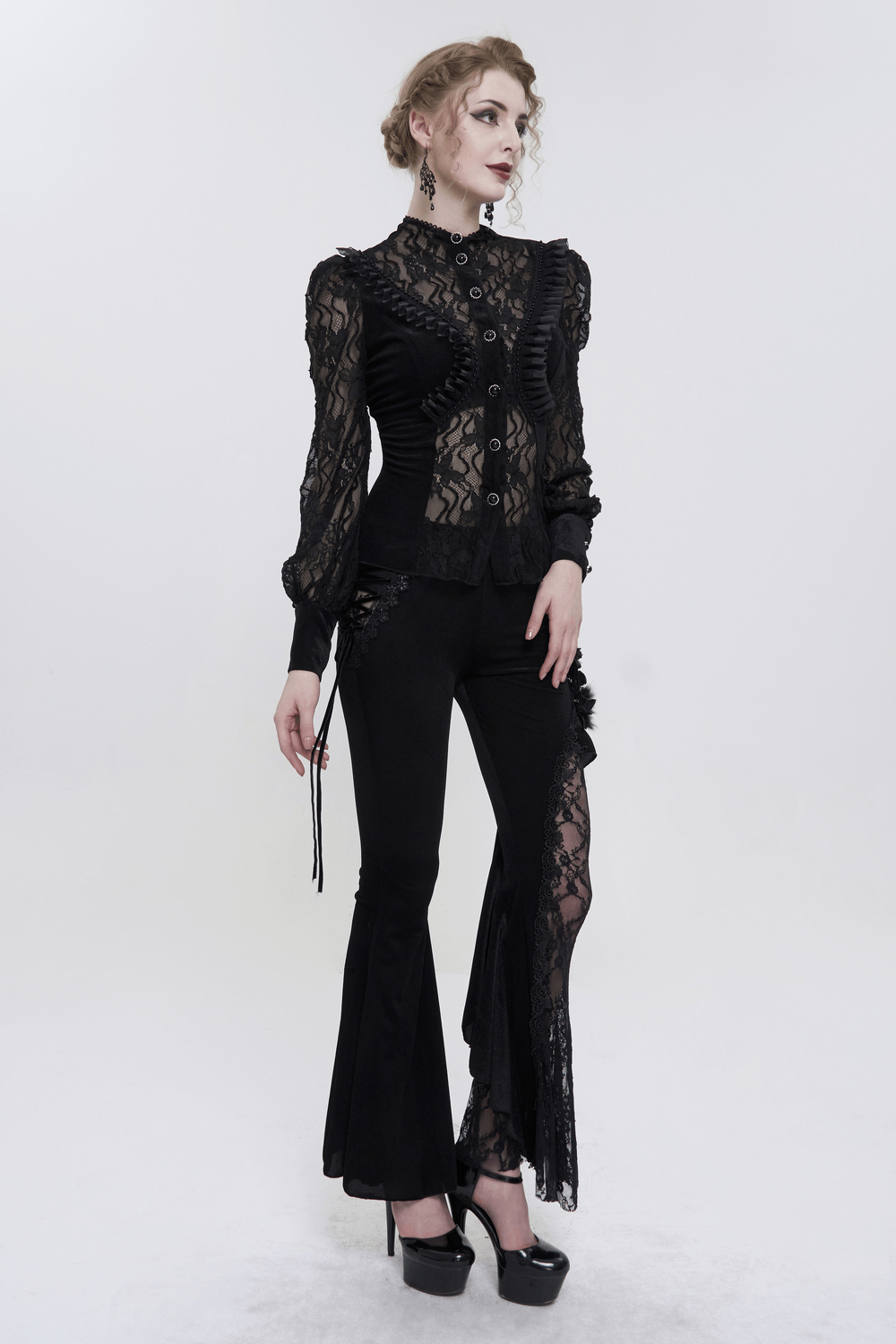 Elegant black lace ruffle blouse paired with flared pants, perfect for gothic fashion enthusiasts.