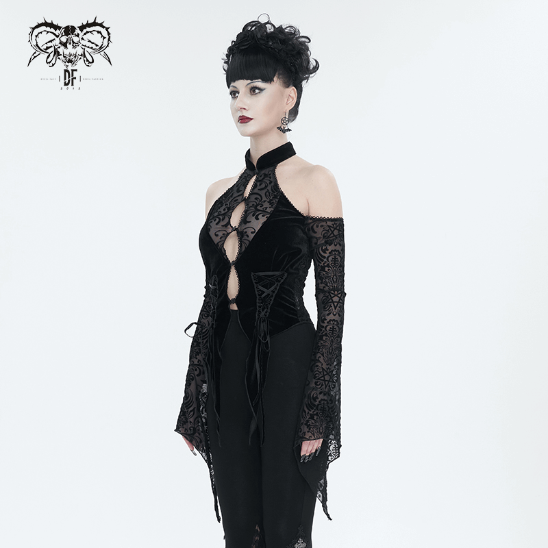 Stylish woman in a black vintage velvet open shoulders top with long sleeves and halter neck for a chic look.