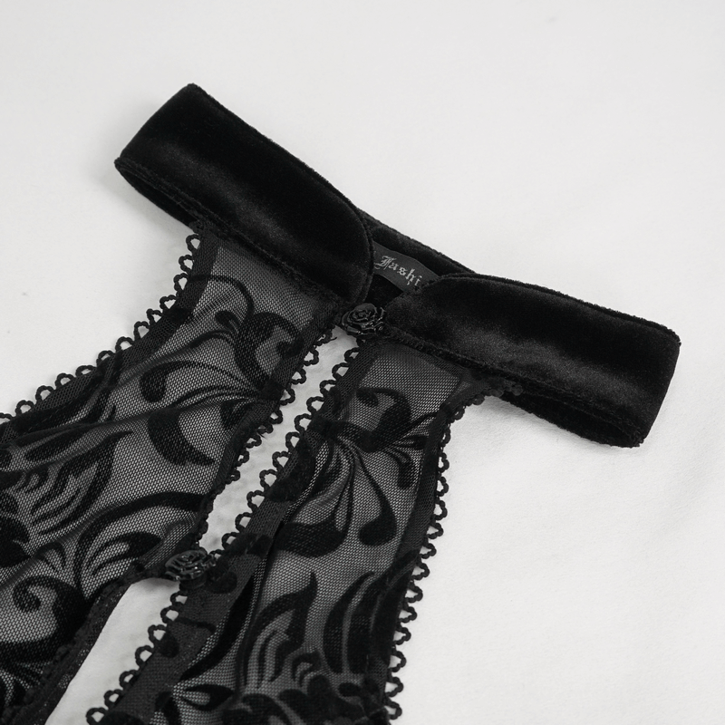 Close-up of black vintage velvet top with lace details and a stylish bow collar, perfect for a chic fashion statement.