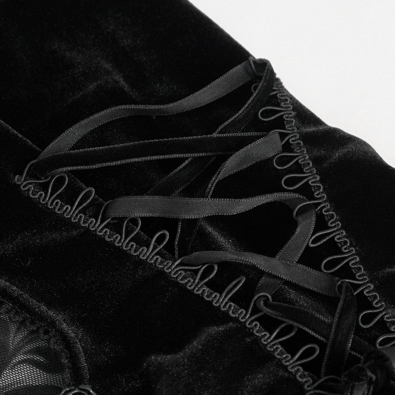 Close-up of black velvet fabric with intricate ribbon detailing on a sexy women's top.