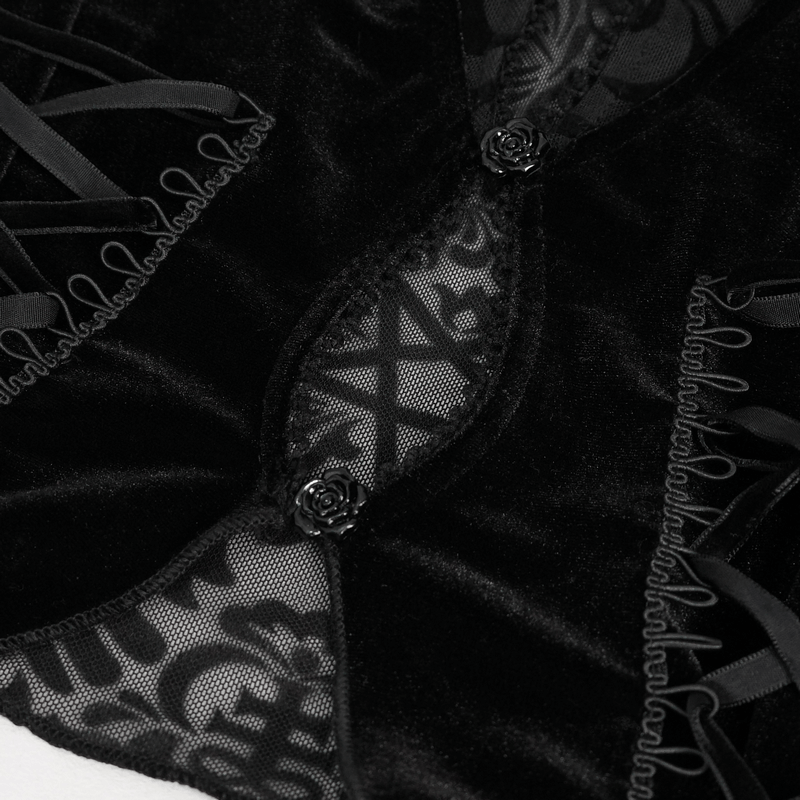 Close-up of black velvet top featuring delicate lace and ribbon details, perfect for a vintage-inspired outfit.