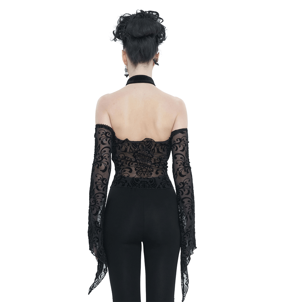 Back view of a black open shoulders vintage velvet top with long sleeves and halter neck, showcasing elegant detailing.