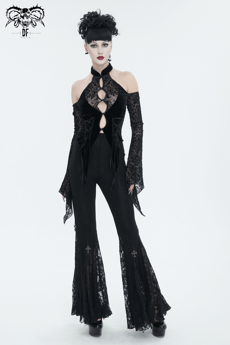 Edgy woman in a black sexy open shoulders velvet top with long lace sleeves and flared pants, exuding vintage charm.