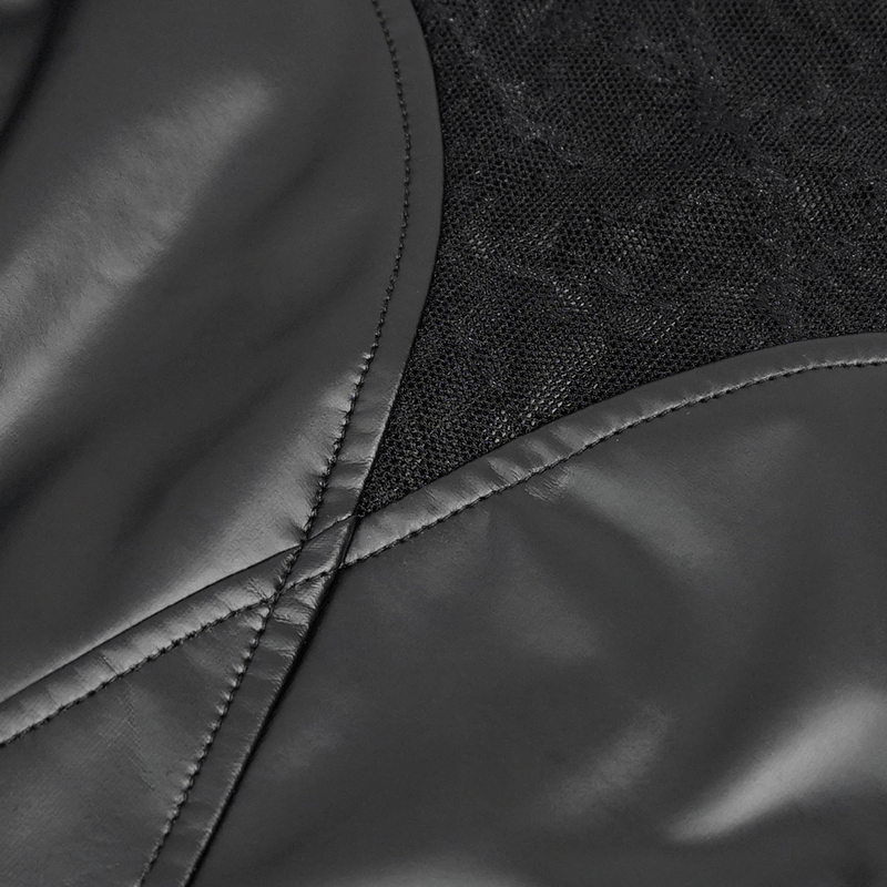 Close-up of black PU leather and mesh fabric showcasing the stylish details of a women's punk crop top.
